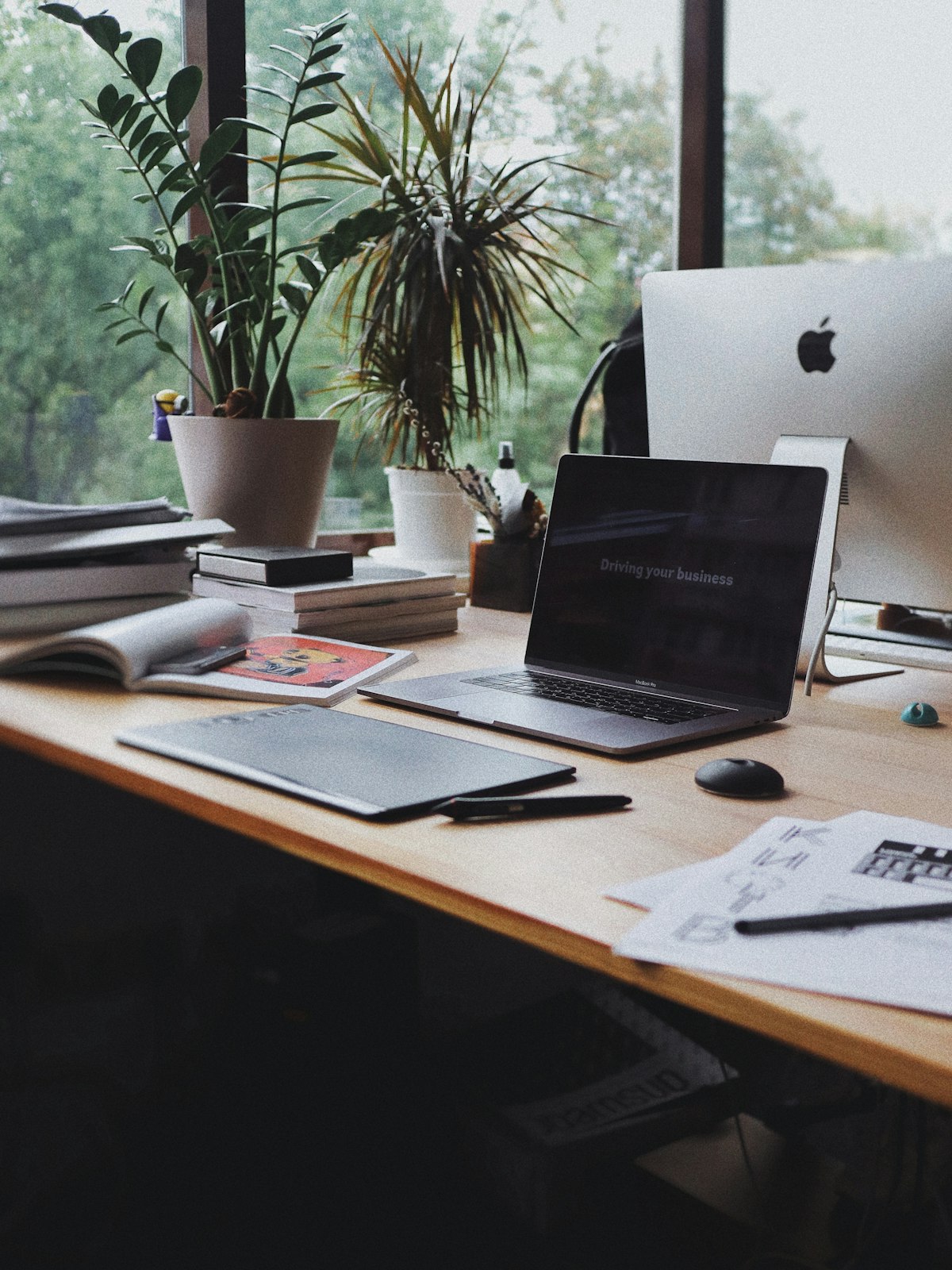Planning social media content on a phone and laptop